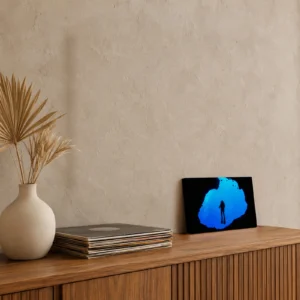 Small diver silhouette in Palau's Blue Hole canvas print on a teak media console, leaning against the wall