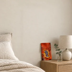 Small Chromodoris quadricolor canvas print on an oak bedside table, leaning against the wall