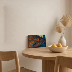 Small coral hind and cleaner wrasse canvas print on a round oak table, leaning against the wall